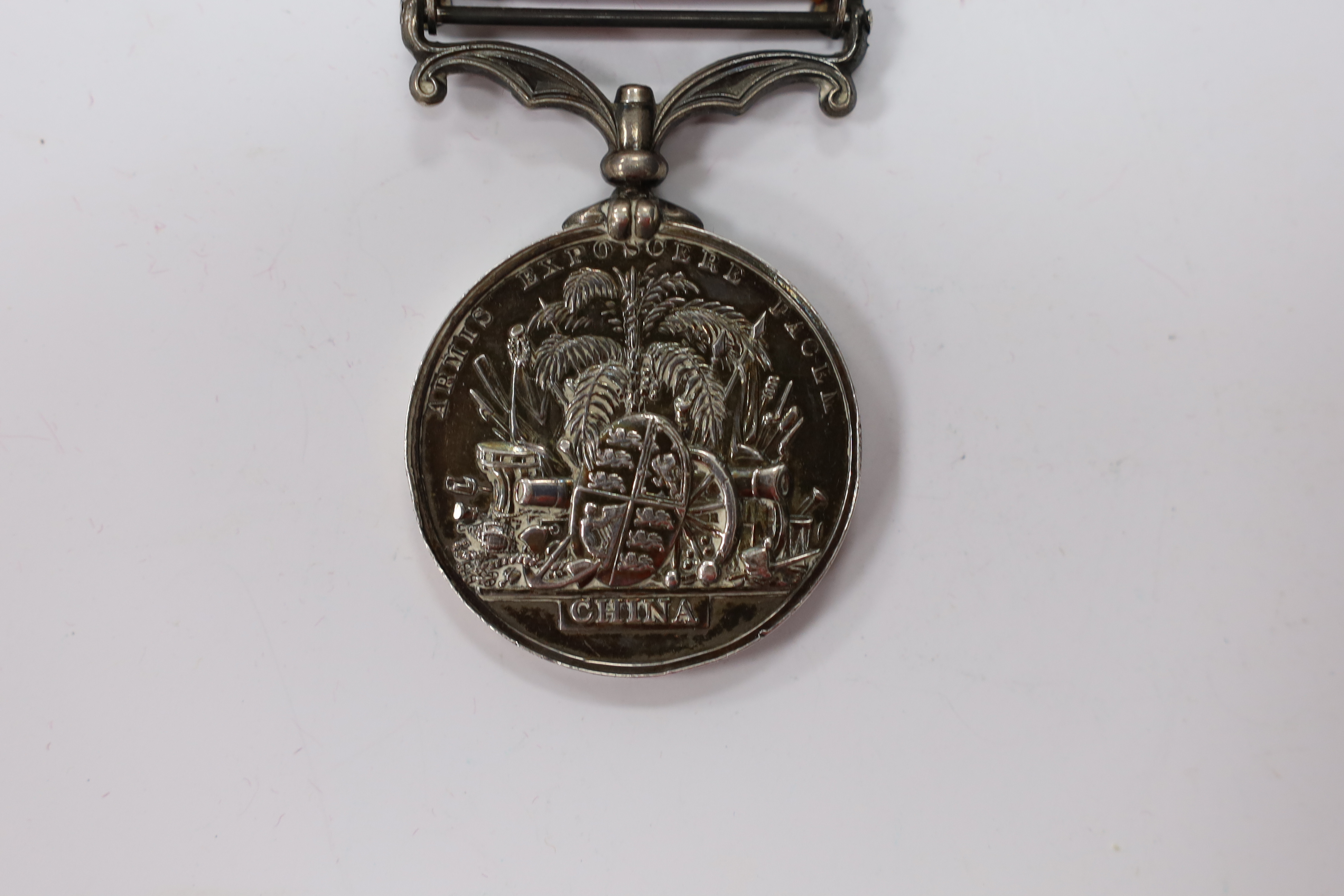 A Second China War Medal 1861 with Canton 1857 clasp, unnamed, navy issue.